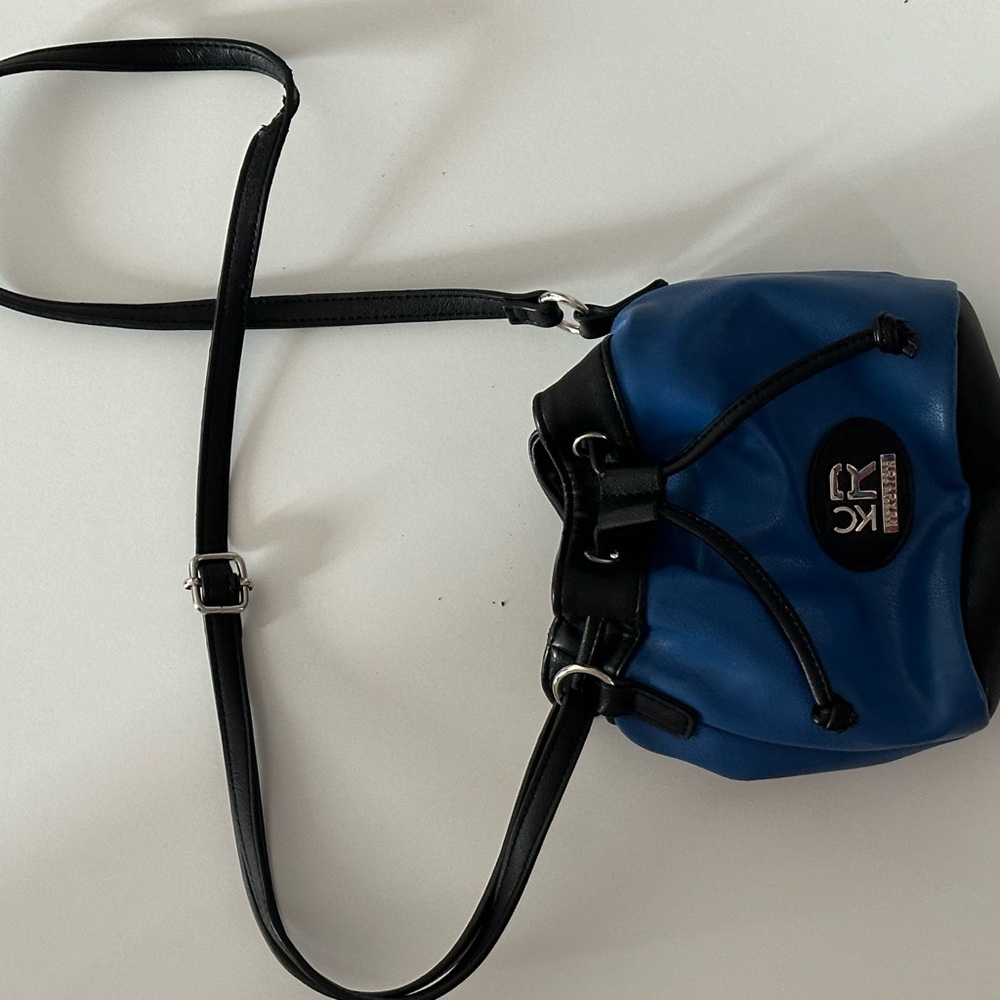 Blue bucket crossbody bag.